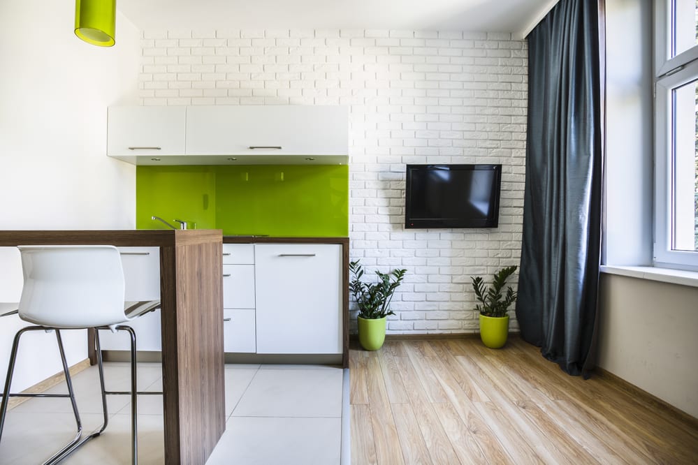Недвижимость: Modern studio flat interior with white bricks