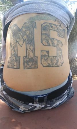 Закон и право: фотография татуировки на спине члена MS-13